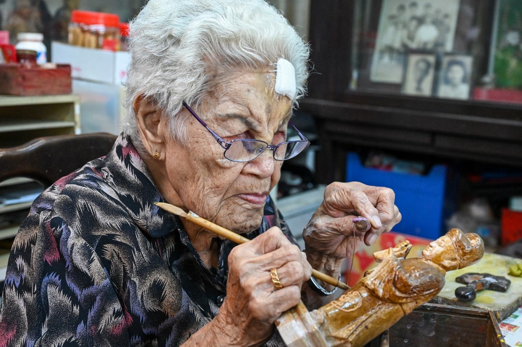 Singaporean artisan family keeps religious effigy art alive