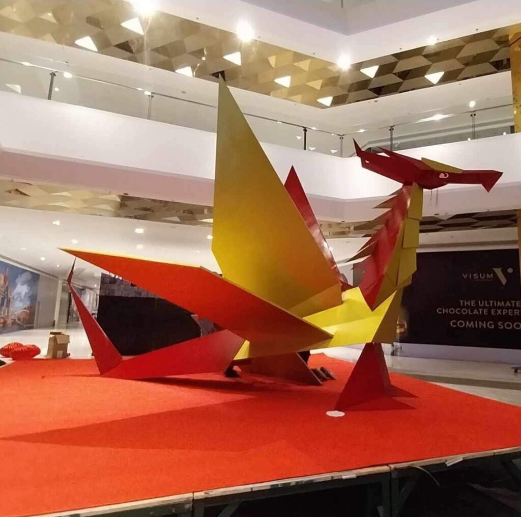 Design students craft giant origami-inspired dragon figures to celebrate CNY